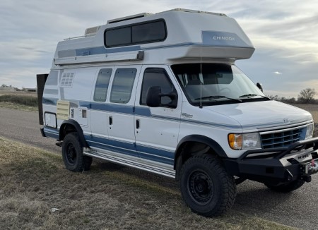 Lifted Chinook RV on the side of a rural road