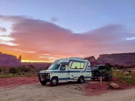 Lifted Chinook RV on the side of a rural road
