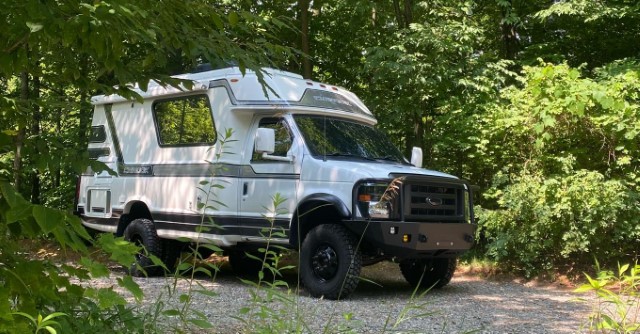 4WD Chinook RV in the woods on a rocky road